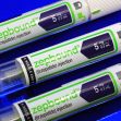 Close-up of three Zepbound tirzepatide injection syringes on a blue background