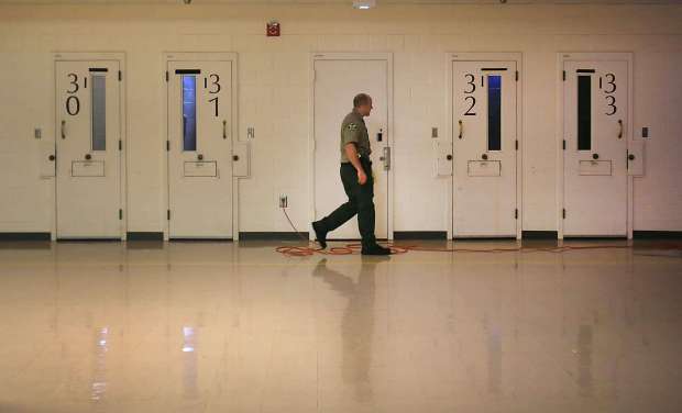 Sonoma County sheriff corrections officer checks jail cells in the...