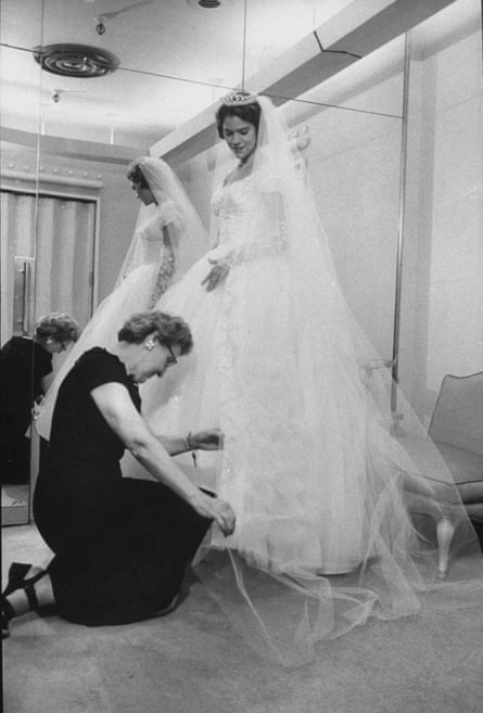 a women in a wedding gown fitting