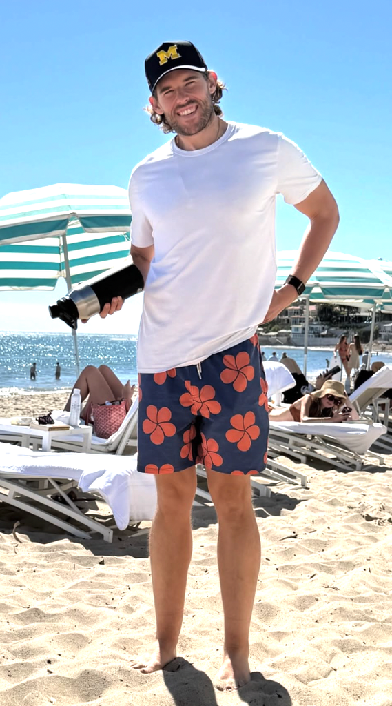 Christopher looks leaner than ever in floral swim trunks