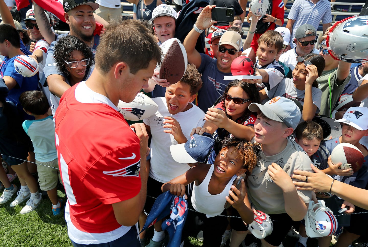 Lots of Patriots fans, young and old, flocked to get an autograph from the big star, quarterback Drake Maye, Saturday on the first day of training camp in Foxborough.