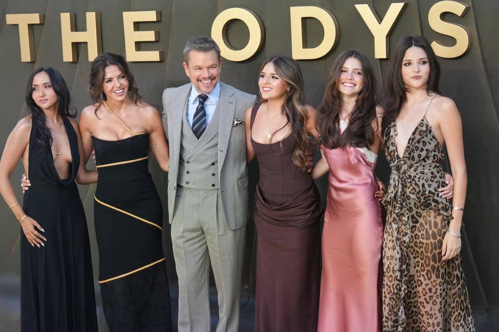 photo of matt damon with wife and four daughters on red carpet