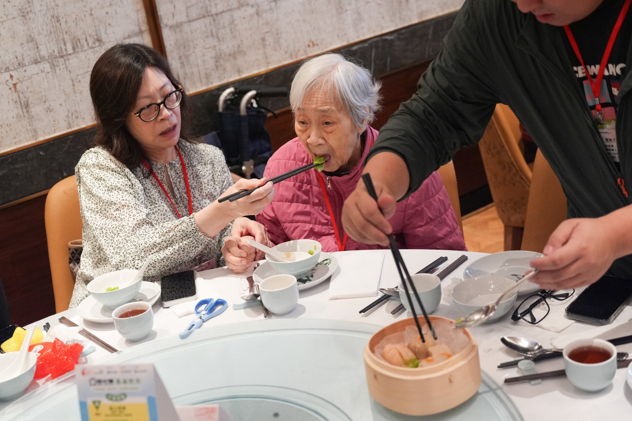 An elderly woman dines at a dim sum restaurant in Tsuen Wan. Photo: Eugene Lee