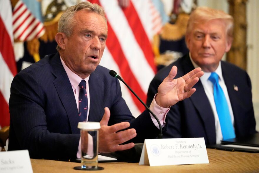 Health and Human Services Secretary Robert F. Kennedy Jr. speaks as President Donald Trump listens at an event to promote his proposal to improve Americans' access to their medical records in the East Room of the White House, Wednesday, July 30, 2025, in Washington.