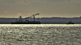 contractors work on line 5 in a body of water