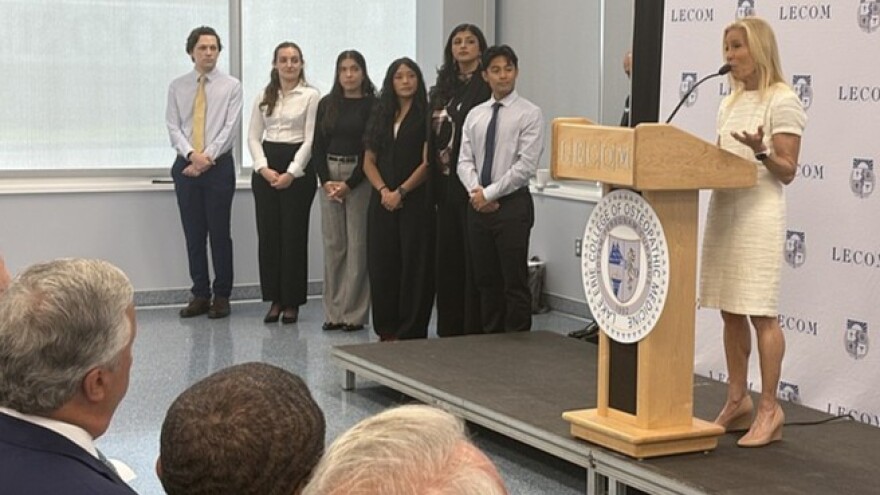 Mayor Donna Deegan, flanked by members of the inaugural class of osteopathic doctors, speaks at Lake Erie College of Medicine at Jacksonville University’s ribbon-cutting ceremony.