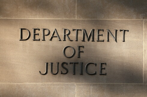 Shadows are cast on a sign at the U.S. Department of Justice building in Washington, D.C., on Sept. 23, 2025.