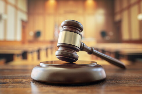 A judge's gavel in a courtroom.