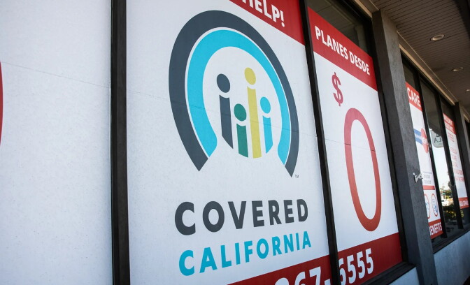a sign in a window facing the street reads "COVERED CALIFORNIA"