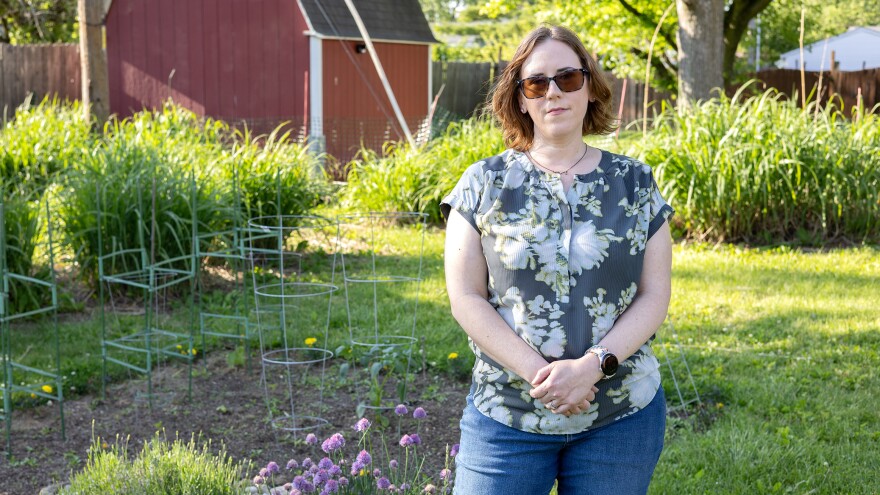 Jessie Fisk in her Indianapolis garden on Tuesday, May 12, 2026 where she grows vegetables and raises chickens. Fisk's daughter Christah has to travel out-of-state for her pediatric gender-affirming care after Indiana's ban on healthcare went into effect in 2024.