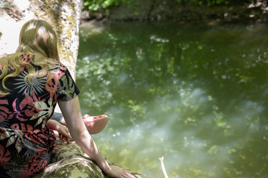 Flower looks for wildlife at a creek in an Indianapolis park on Thursday, May 14, 2026.