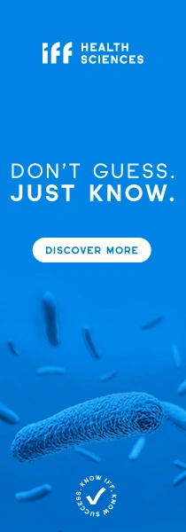 Blue Health Sciences advertisement with the slogan “DON’T GUESS. JUST KNOW.” above a “DISCOVER MORE” button, featuring microscopic bacteria imagery and a large magnified microbe at the bottom.