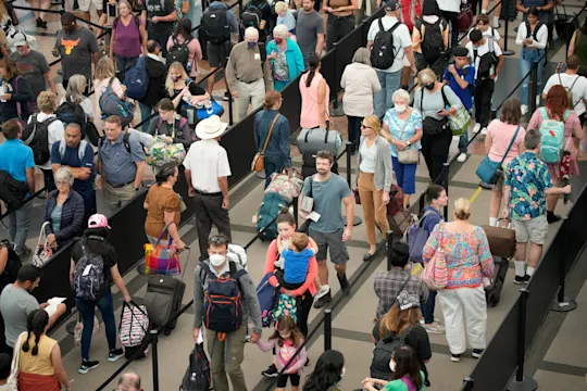 Travelers on line at airport