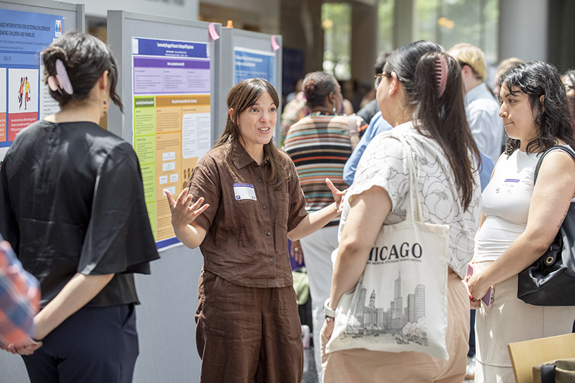 CERC poster presenter speaking to attendees