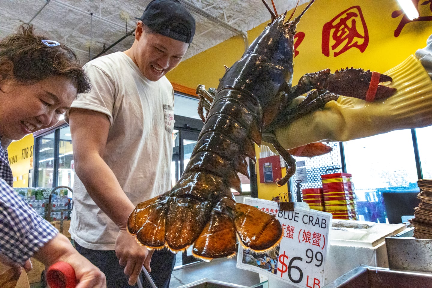 Chef Laurence Louie of Rubato checked out the lobsters and crabs in the seafood section of C Mart in Quincy.