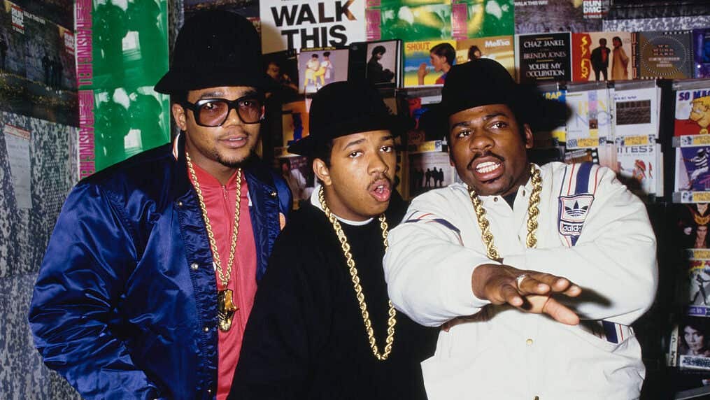 American hip hop group Run-DMC posed in an HMV record store in 1986. Left to right: Darryl 'DMC' McDaniels, Joseph 'Run' Simmons, Jason 'Jam-Master Jay' Mizell.