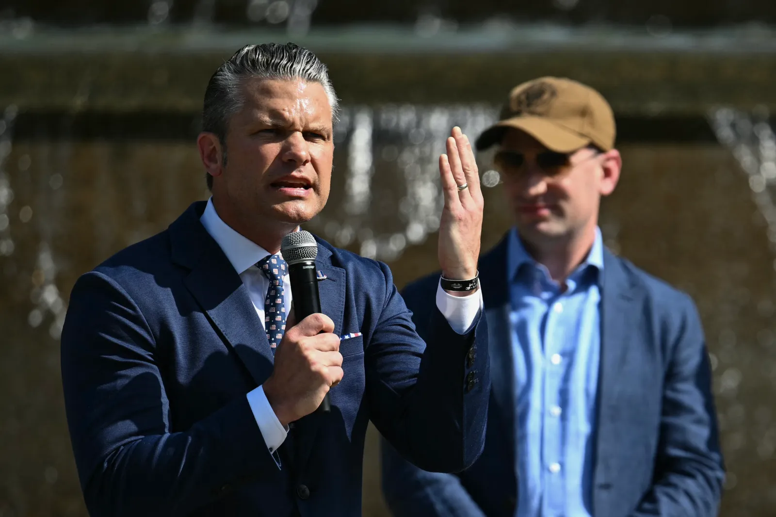US Secretary of Defense Pete Hegseth speaks alongside White House Deputy Chief of Staff Stephen Miller during a "DC Safe and Beautiful Task Force" ceremony with the National Guard at Meridian Hill Park in Washington, DC, on July 2, 2026.