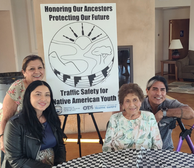 Cindy Galvez, Alexxa Cassanova, Josie Villalobos, and Johnny Bear Contreras, at the San Pasqual Band of the Kumeyaay Nation’s cultural center dinner, celebrating and recognizing the TREDS partnership. They are sitting at a round table.
