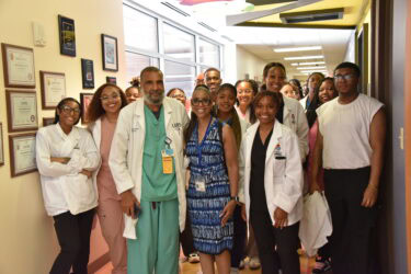 HCOP Academy students and organizers are shown with Billy Thomas, M.D., professor and neonatologist in the UAMS College of Medicine’s Department of Pediatrics.