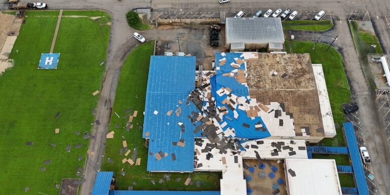 Strong winds damage Cross County High School gym Strong winds damage Cross County High School gym