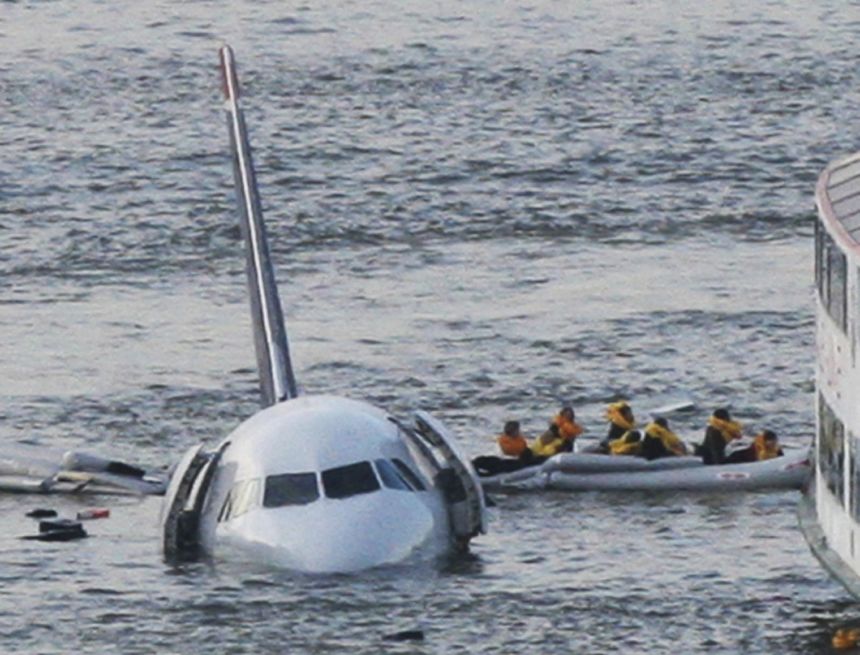 Passengers in an inflatable raft move away from US Airways Flight 1549 that went down in the Hudson River in New York on January 15, 2009.