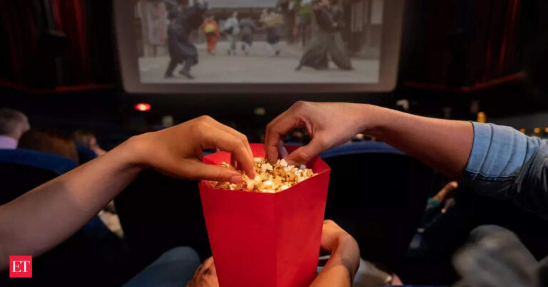 Psychology explains why people eating popcorn at movie theaters may be less likely to buy new brands