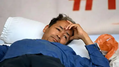 Getty Images  Activist Sonam Wangchuk continues his indefinite hunger strike for the sixteenth consecutive day in solidarity with the protest by Cockroach Janta Party demanding the immediate resignation of Union Education Minister Dharmendra Pradhan following paper leak irregularities during the national NEET-UG 2026 medical entrance examinations, at Janatar Mantar on July 13, 2026 in New Delhi, India.