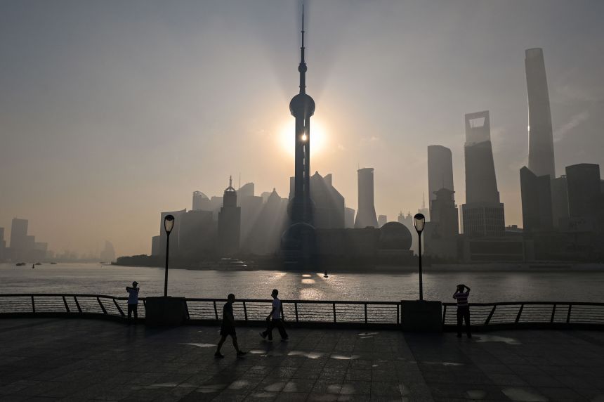 View of the financial district of Lujiazui during sunrise in Shanghai on September 7, 2022.