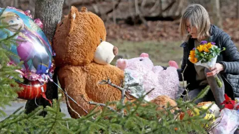 Getty Images A makeshift memorial in Duxbury, Massachusetts for Cora, Dawson, and Callan