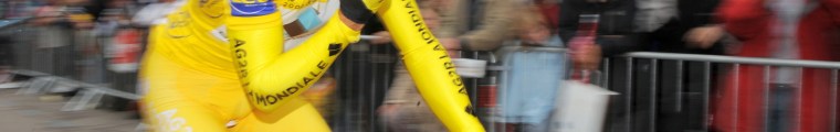 A bicycle racer eats during competition.