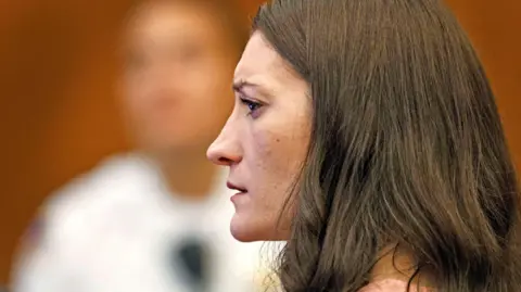 Reuters Lindsay Clancy watches as her ex-husband Patrick Clancy takes the witness stand