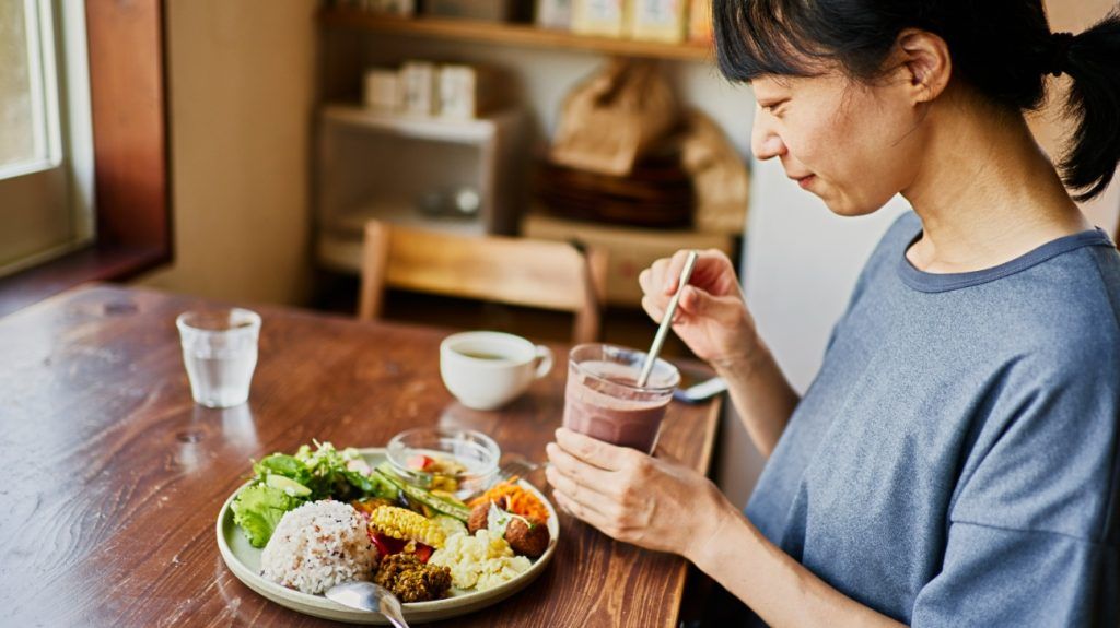 Japanese woman eating a vegan meal