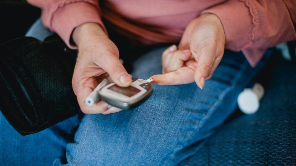 A person checking their blood sugar levels.
