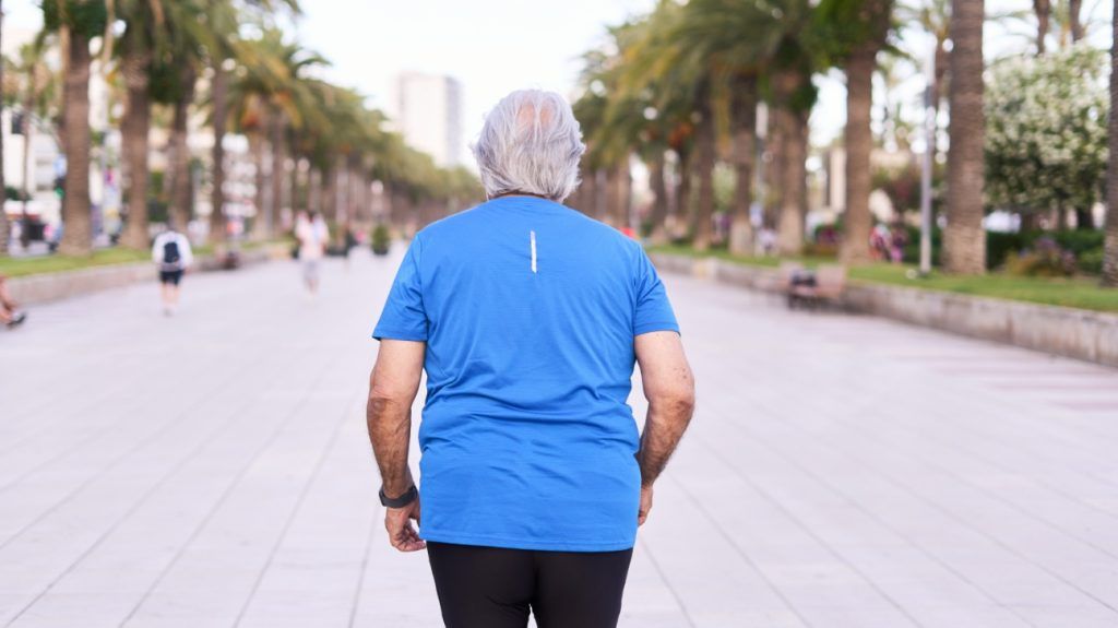 An older adult walking for exercise.