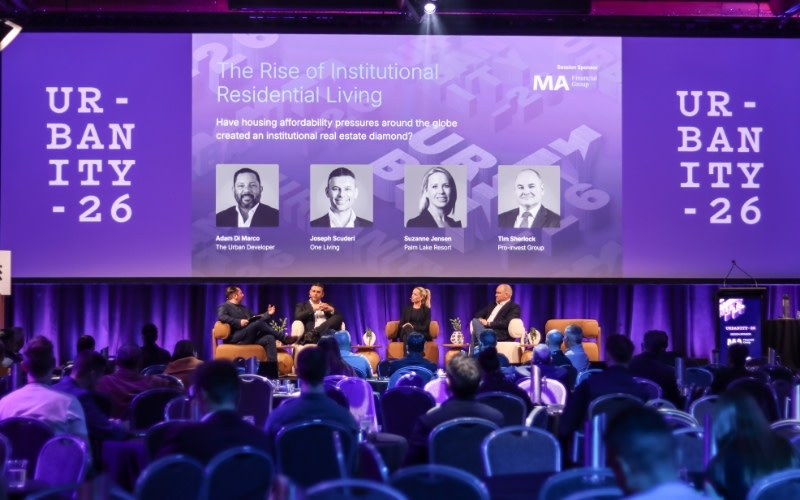 A photograph of speakers on institutional residential living at the Urbanity-26 conference