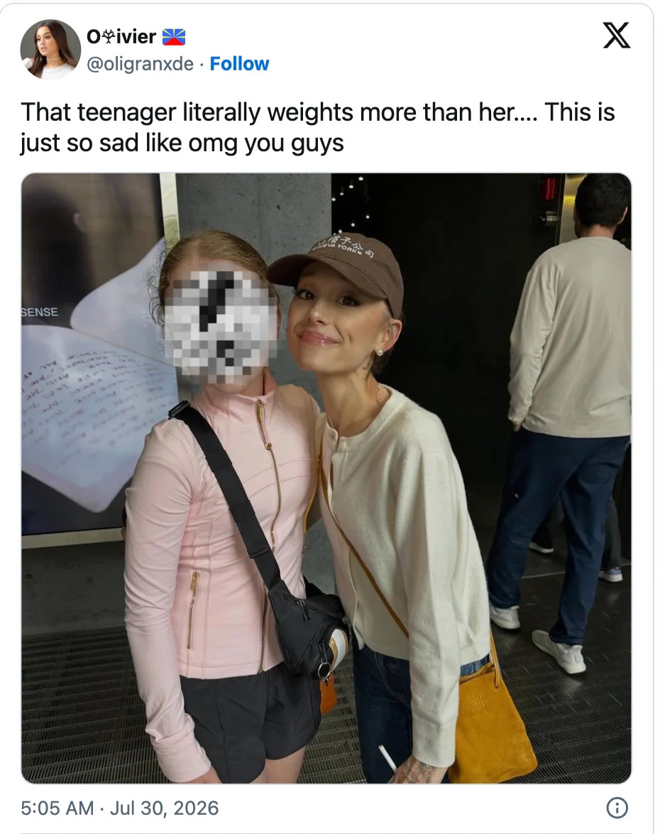 Grande (left) posing with a fan. Yahoo Canada has edited the photo because the fan is reportedly underage. (Image via X)