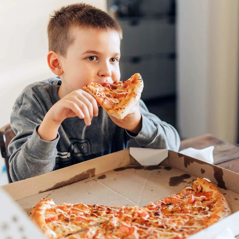 Child eating a pizza