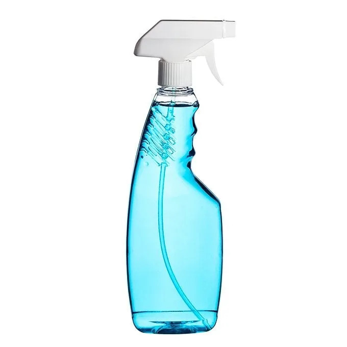 A blue spray bottle stands upright, featuring a white nozzle. It's filled with liquid, ready for cleaning surfaces. The background is plain and unobtrusive.