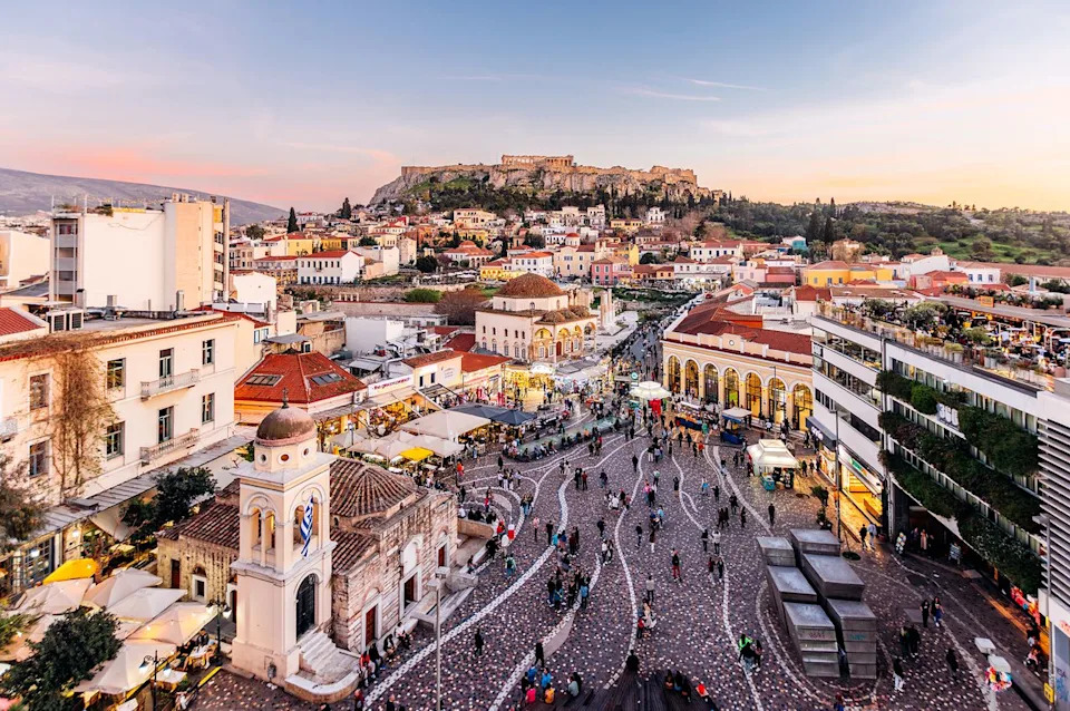 Athens cityscape with Monastiraki square and Acropolis illuminated at dusk.Credit: Alexander Spatari/Getty Images