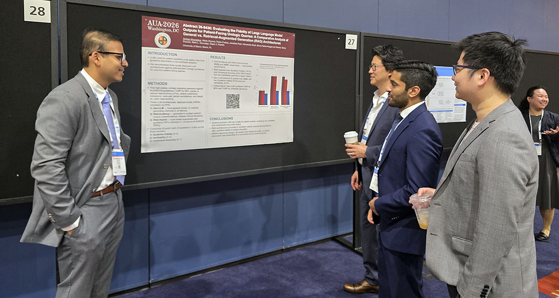 Attendees review and discuss a research poster at the American Urological Association 2026 meeting, displayed on a conference board with charts and text sections outlining study methods and results.