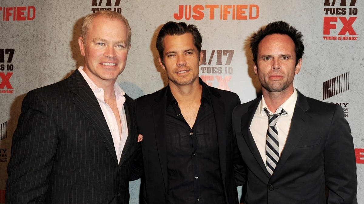 Neal McDonough, Timothy Olyphant and Walton Goggins arrive at a premiere in Los Angeles.