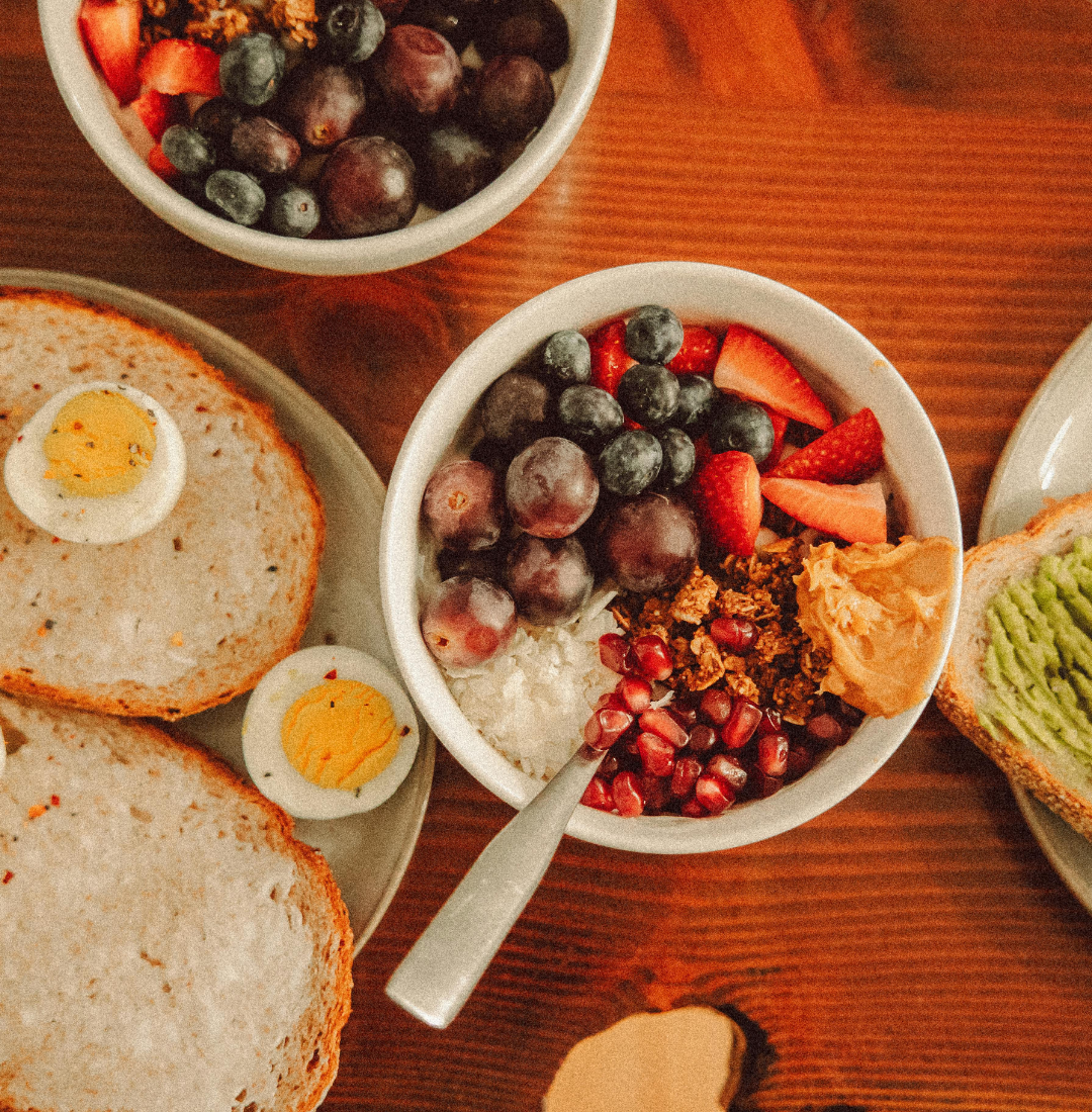 table with healthy food: bread, egg, fruit