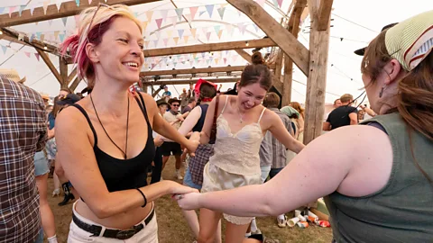 Getty Images Three women dancing at the Country Music Festival at Tooting Common, London (Credit: Getty Images)