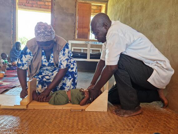 Health workers measure a child at Ouadda Nutrition Centre in the Central African Republic as part of screenings to detect malnutrition among children under 5. Photo: UNOCHA/Regis Maloundou