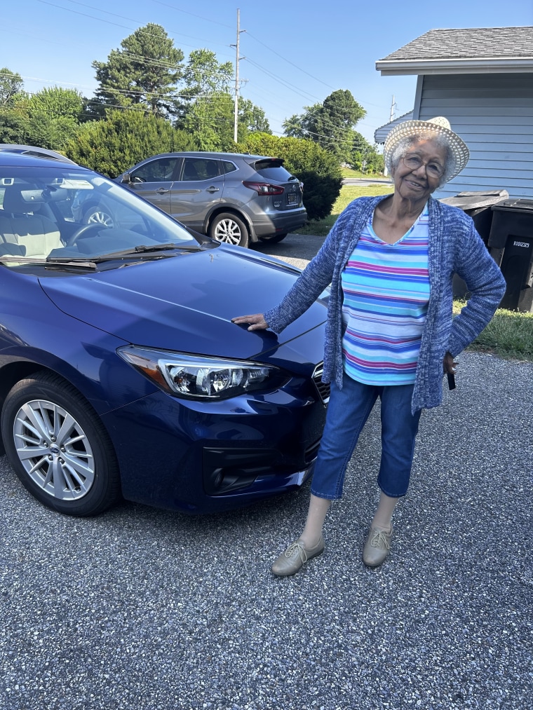 Susan Young Browne with her trusty blue Subaru.