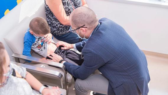 Dr. Trucco giving a patient a clinical exam
