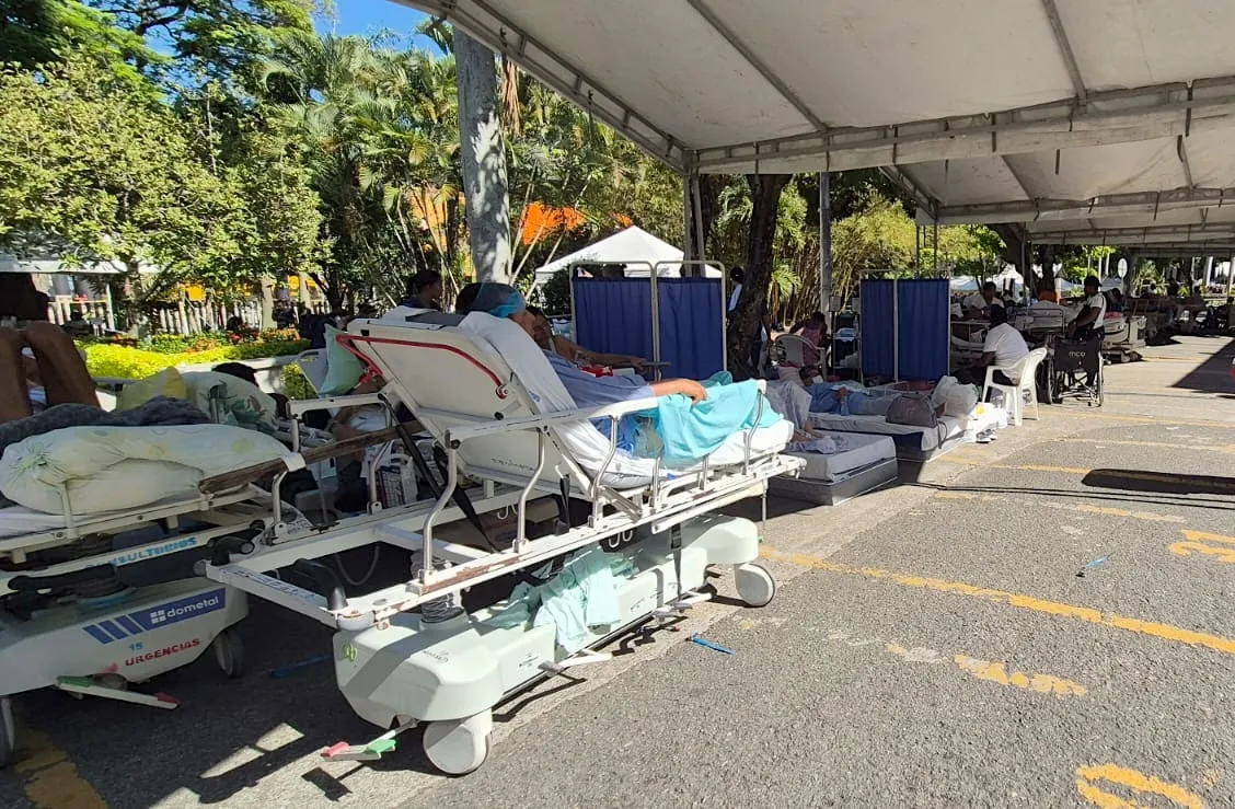 medical bed holding patient in open-tent pop-up medical clinics in Colombia