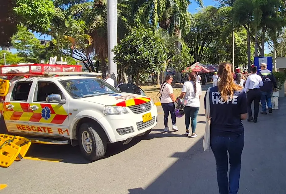 Project HOPE staff standing by ambulance assessing damage in Colombia post-earthquake