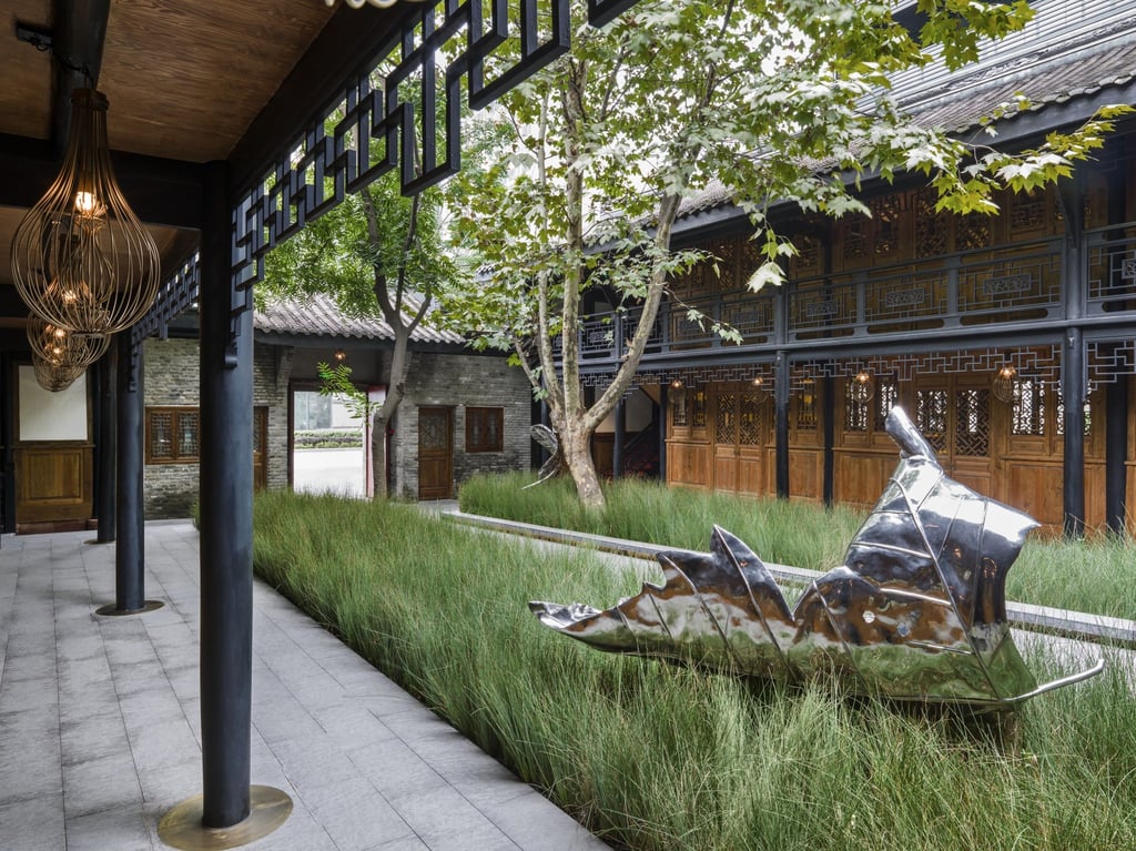 The entrance courtyard features modern artworks. Photo: Handout