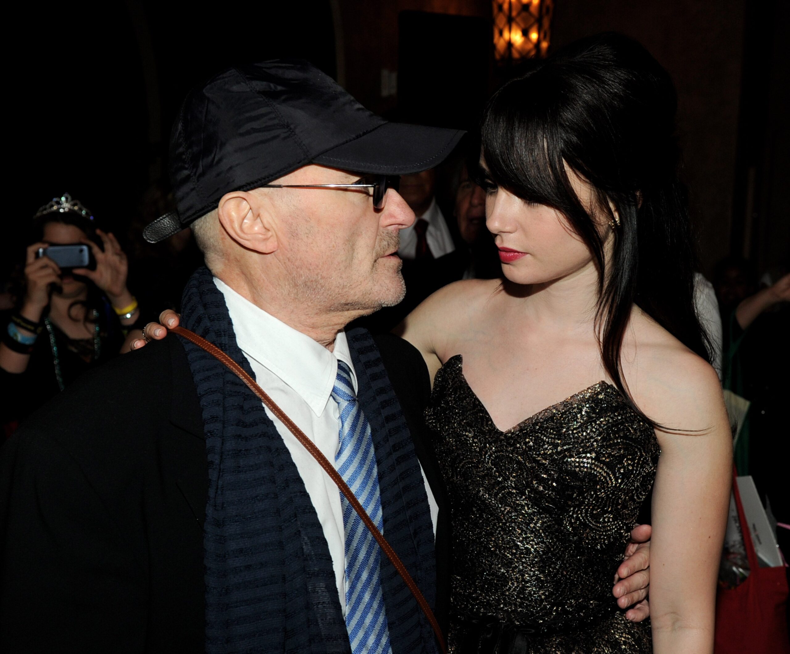 Phil Collins with his daughter, actor Lily Collins, in 2012